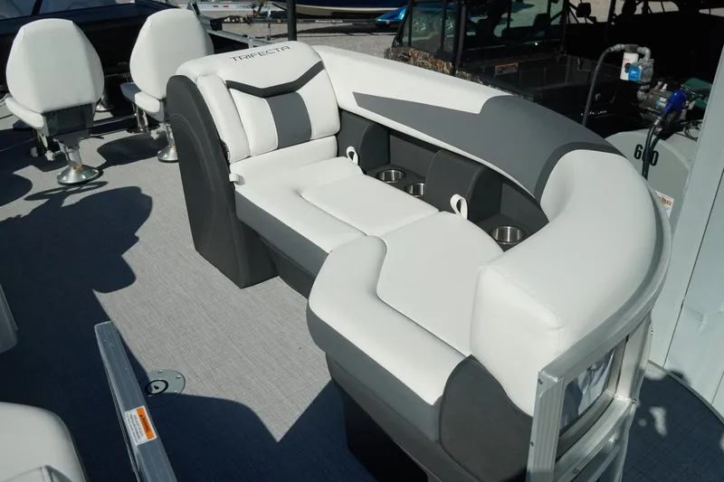 Slide: The Image of 2026 Trifecta 24E CS boat interior with stylish seating and cup holders. - 15