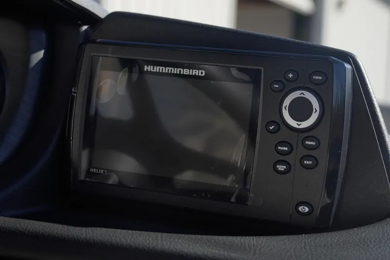 Slide: The Image of Humminbird Helix 5 fish finder on Trifecta 24E CS, 2026 model dashboard. - 31