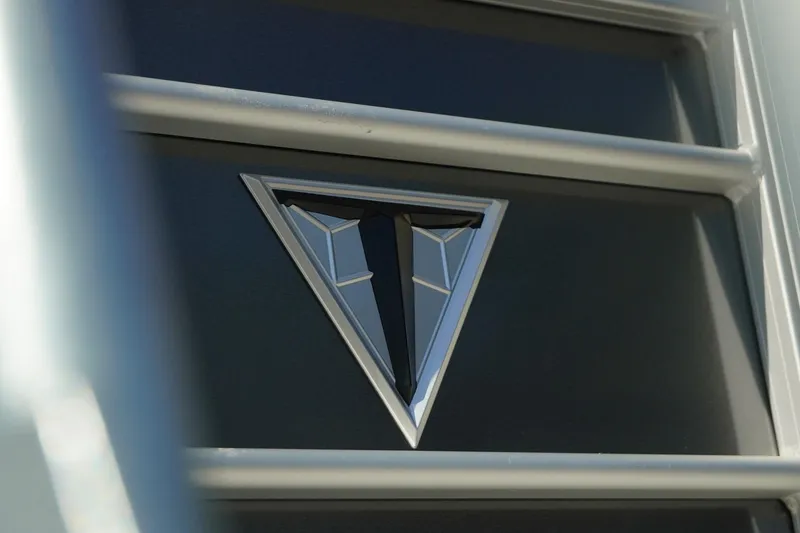 Slide: The Image of Close-up of 2026 Trifecta 24E CS logo on a sleek metallic surface. - 39