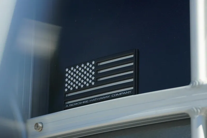 Slide: The Image of 2026 Trifecta 24E CS with American flag emblem, Berkshire Hathaway branding. - 41
