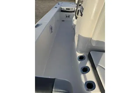Slide: The Image of 2026 Rabalo 206 Cayman boat interior with seating and cup holders. - 14