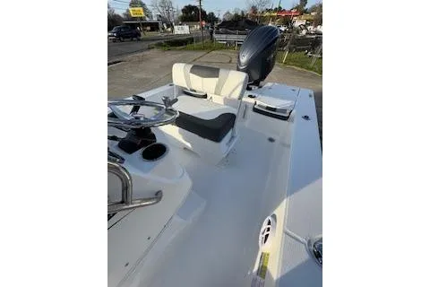 Slide: The Image of 2026 Rabalo 206 Cayman boat interior with steering wheel and seating. - 15