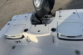 Slide: The Image of 2026 Rabalo 206 Cayman boat deck with motor, featuring storage compartments. - 18