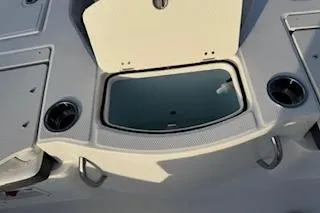 Slide: The Image of 2026 Rabalo 206 Cayman boat deck with storage compartment and cup holders. - 21