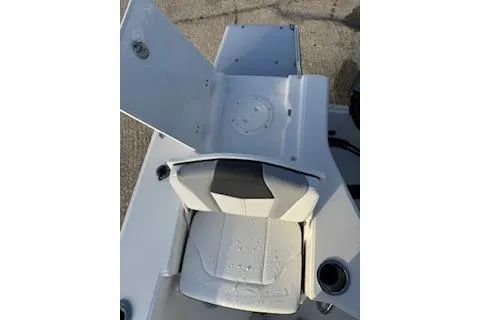 Slide: The Image of 2026 Rabalo 206 Cayman boat seat with storage compartment, featuring sleek design and cup holders. - 22
