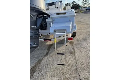 Slide: The Image of 2026 Rabalo 206 Cayman boat with ladder on a trailer in a parking lot. - 4