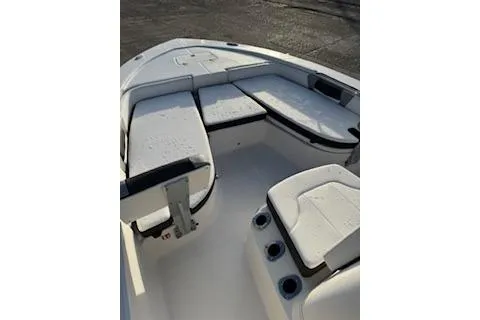 Slide: The Image of 2026 Rabalo 206 Cayman boat interior with cushioned seating and cup holders. - 6