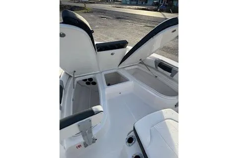 Slide: The Image of 2026 Rabalo 206 Cayman boat interior with open storage compartments and seating. - 7