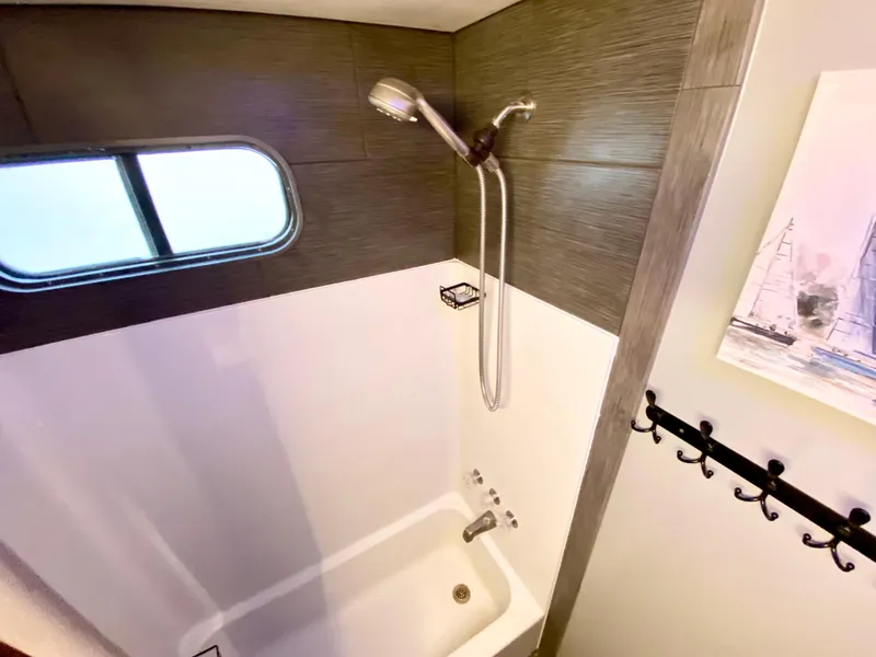 Slide: The Image of Shower area in 1988 Three Buoys 4412 boat with window and wall hooks. - 18
