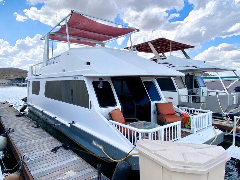Slide: The Image of Modern kitchen in 1988 Three Buoys 4412 boat with sleek countertops and mosaic backsplash. - 3