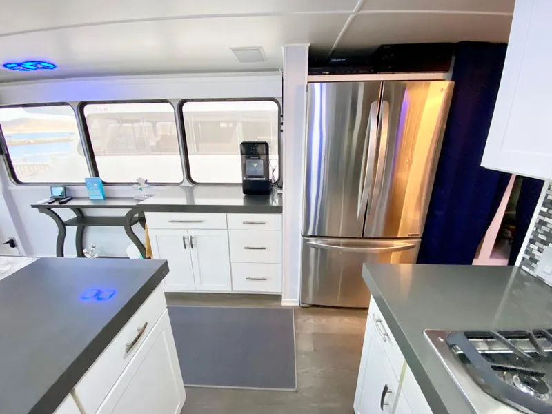 Slide: The Image of Modern kitchen interior on 1988 Three Buoys 4412 boat with stainless steel appliances. - 11