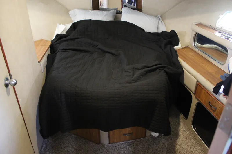 Slide: The Image of 1987 Chris-Craft 381 Catalina cabin interior with bed and wooden furnishings. - 25