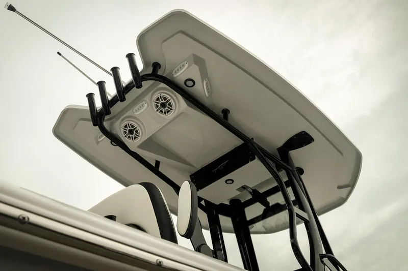 Slide: The Image of 2026 Tidewater 2500 Carolina Bay boat with T-top and rod holders, viewed from below. - 16