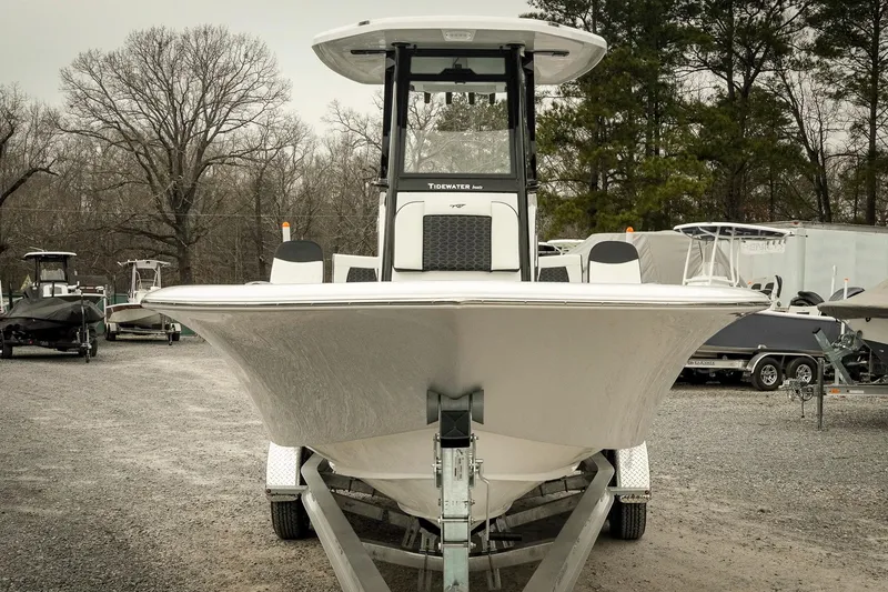 Slide: The Image of 2026 Tidewater 2500 Carolina Bay boat on trailer, parked outdoors. - 2