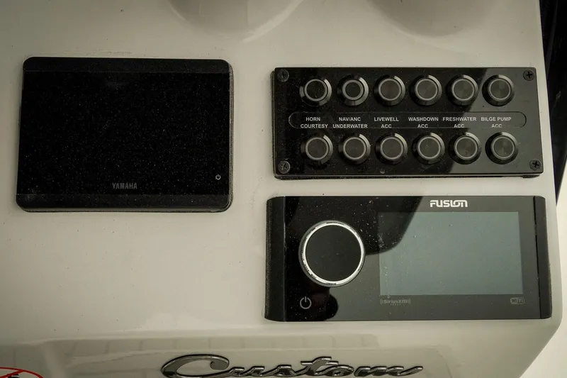 Slide: The Image of Control panel of 2026 Tidewater 2500 Carolina Bay boat with Yamaha and Fusion systems. - 21