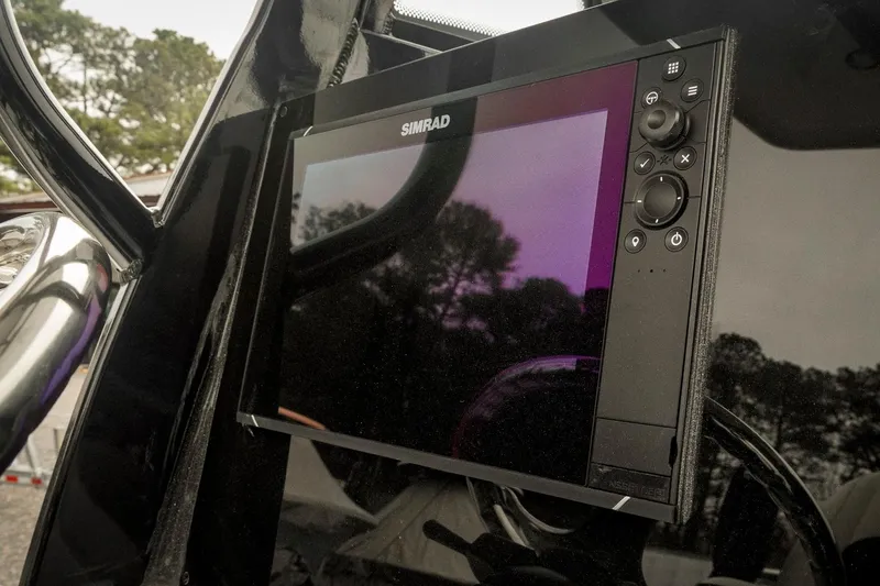 Slide: The Image of Simrad display on 2026 Tidewater 2500 Carolina Bay boat dashboard. - 23