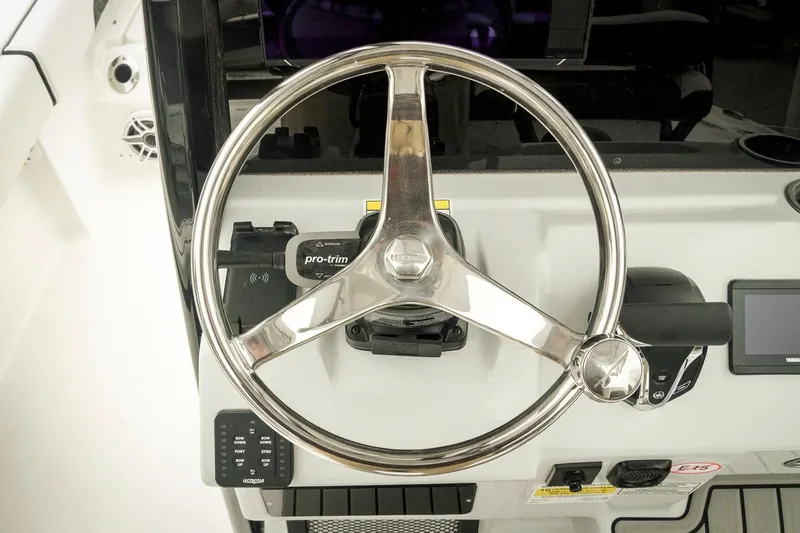 Slide: The Image of Steering wheel of 2026 Tidewater 2500 Carolina Bay boat, featuring modern controls and dashboard. - 24