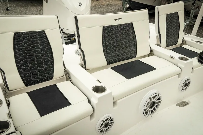 Slide: The Image of 2026 Tidewater 2500 Carolina Bay boat seats with stylish black and white upholstery. - 26