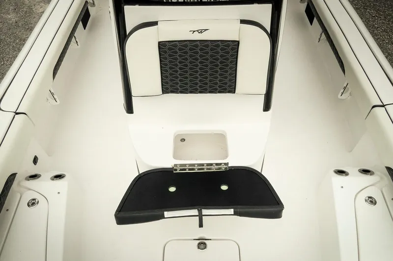Slide: The Image of 2026 Tidewater 2500 Carolina Bay boat interior with seating and storage compartments. - 32