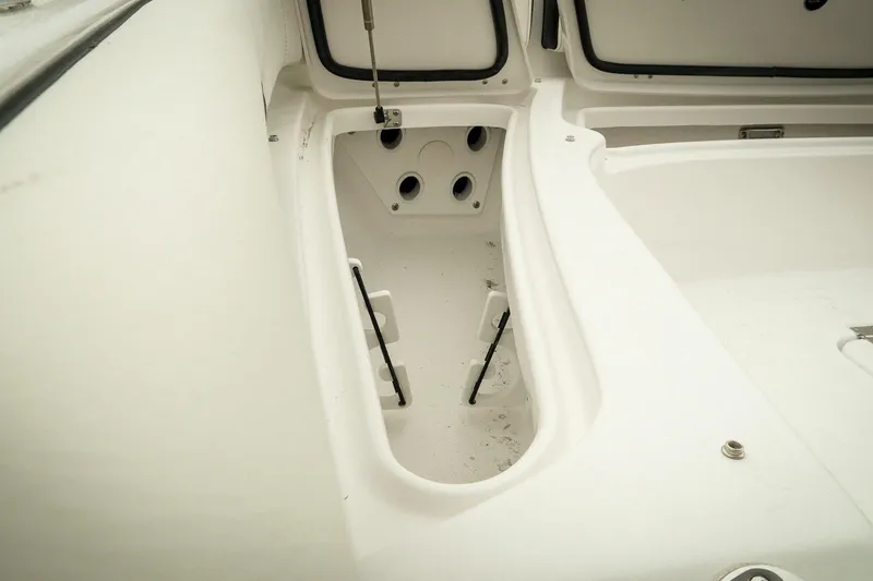 Slide: The Image of 2026 Tidewater 2500 Carolina Bay boat interior storage compartments. - 34