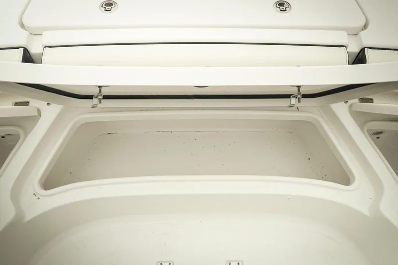 Slide: The Image of 2026 Tidewater 2500 Carolina Bay boat storage compartment, open and empty. - 35