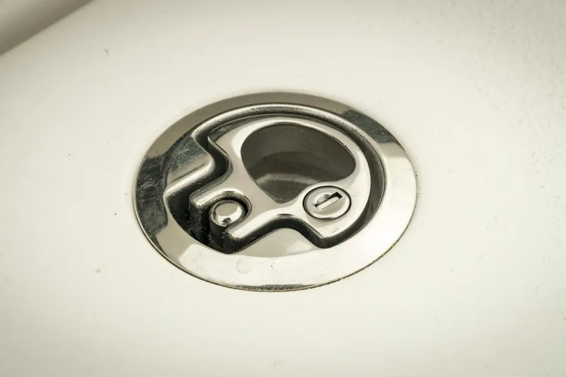 Slide: The Image of Fuel cap of 2026 Tidewater 2500 Carolina Bay boat, featuring a sleek metallic design. - 36