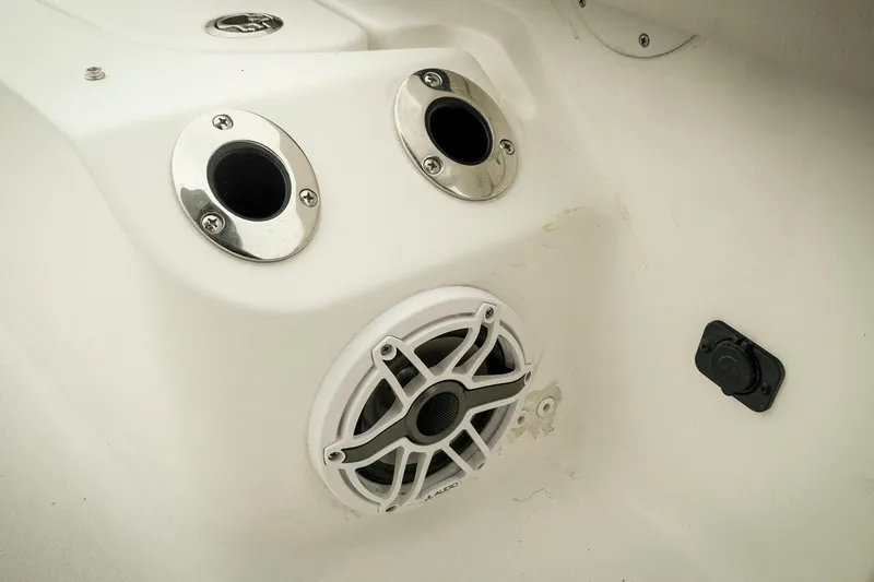 Slide: The Image of 2026 Tidewater 2500 Carolina Bay boat interior with speaker and rod holders. - 37