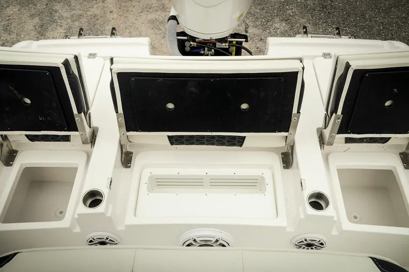 Slide: The Image of 2026 Tidewater 2500 Carolina Bay boat interior with seating and storage compartments. - 42