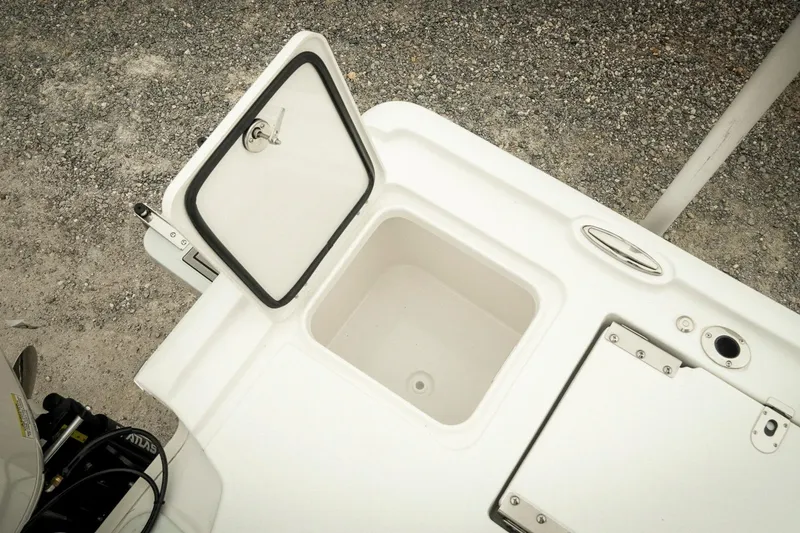 Slide: The Image of 2026 Tidewater 2500 Carolina Bay boat storage compartment with open hatch. - 45