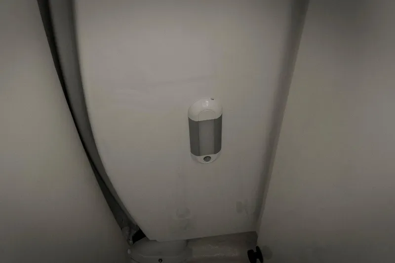 Slide: The Image of Interior view of 2026 Tidewater 2500 Carolina Bay boat, featuring a mounted device. - 52