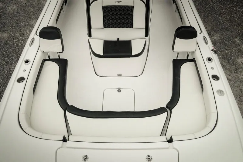 Slide: The Image of 2026 Tidewater 2500 Carolina Bay boat interior with white and black seating. - 53