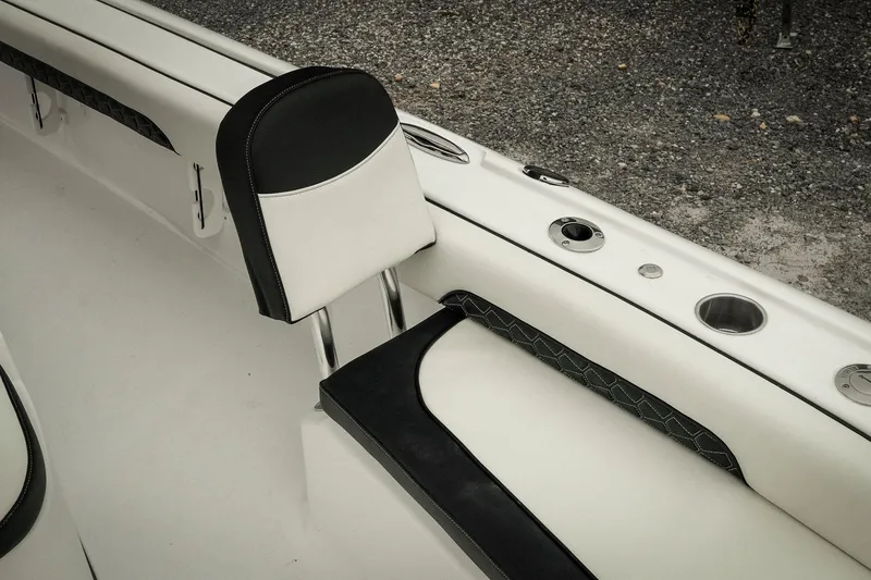 Slide: The Image of 2026 Tidewater 2500 Carolina Bay boat interior with sleek seating and cup holders. - 54