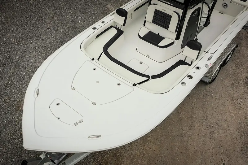 Slide: The Image of 2026 Tidewater 2500 Carolina Bay boat, white deck, sleek design, on trailer, top view. - 6