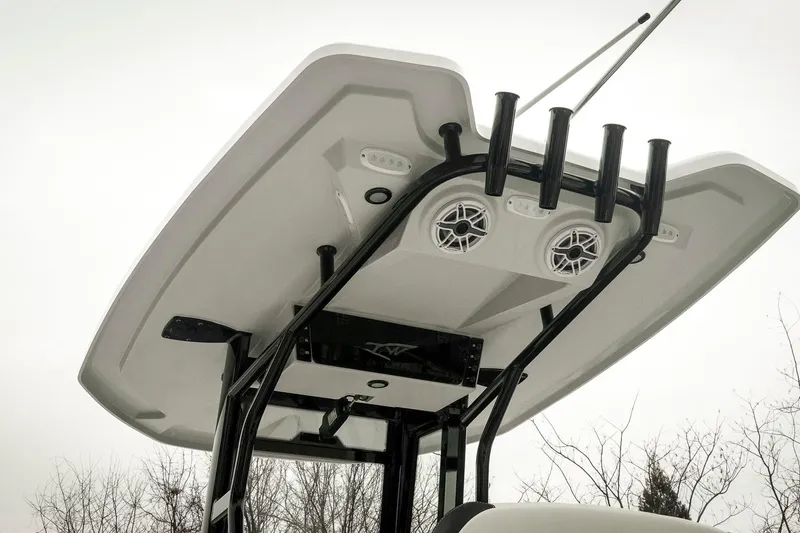 Slide: The Image of 2026 Tidewater 2500 Carolina Bay boat T-top with rod holders and speakers. - 62