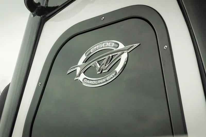 Slide: The Image of 2026 Tidewater 2500 Carolina Bay emblem on a sleek black surface. - 8