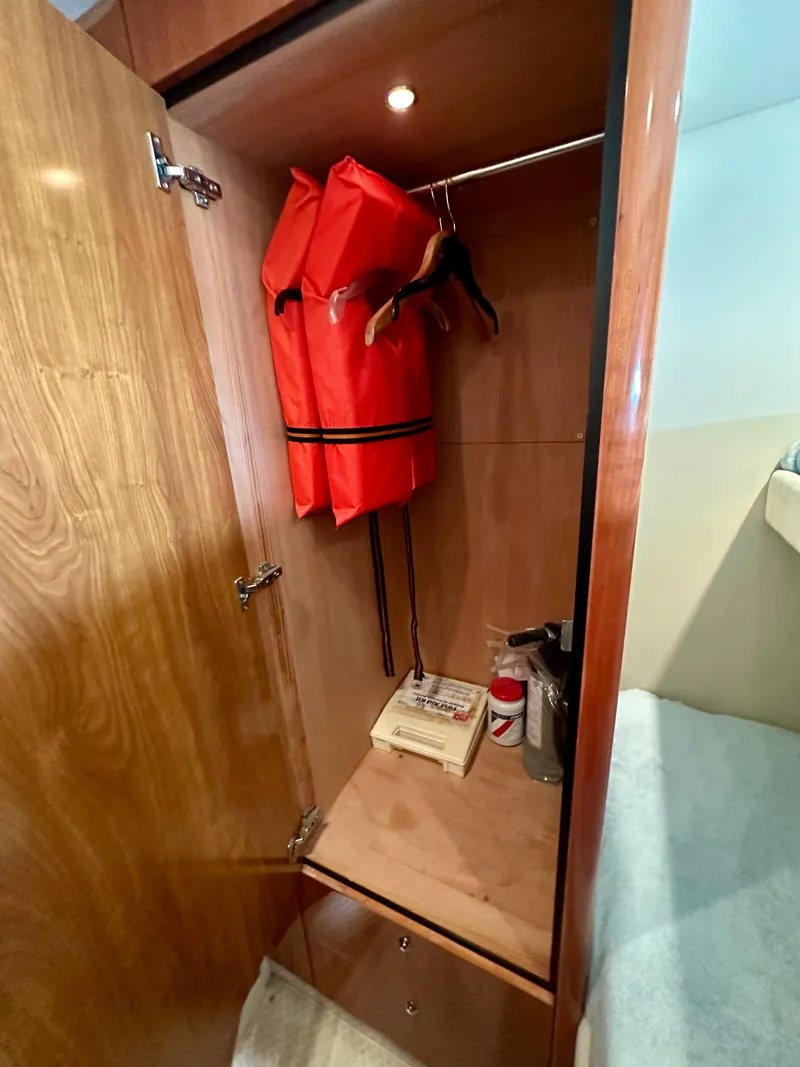 Slide: The Image of 2006 Sunseeker Manhattan 50 yacht closet with life jackets. - 45