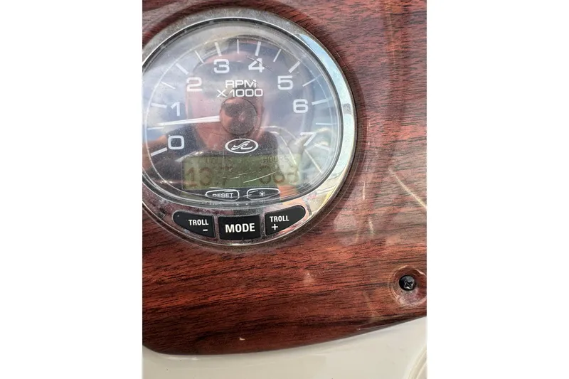 Slide: The Image of Close-up of 2007 Sea Ray 200 Sundeck RPM gauge on wooden dashboard. - 14
