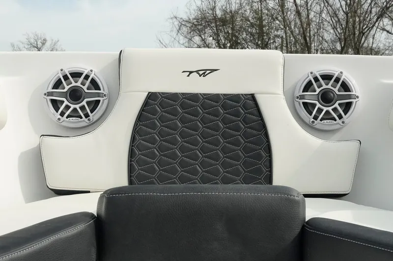Slide: The Image of 2026 Tidewater 232 LXF boat interior with JL Audio speakers and stylish upholstery. - 11