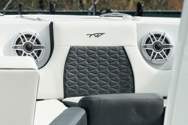 Slide: The Image of 2026 Tidewater 232 LXF boat interior with speakers and stylish upholstery. - 12
