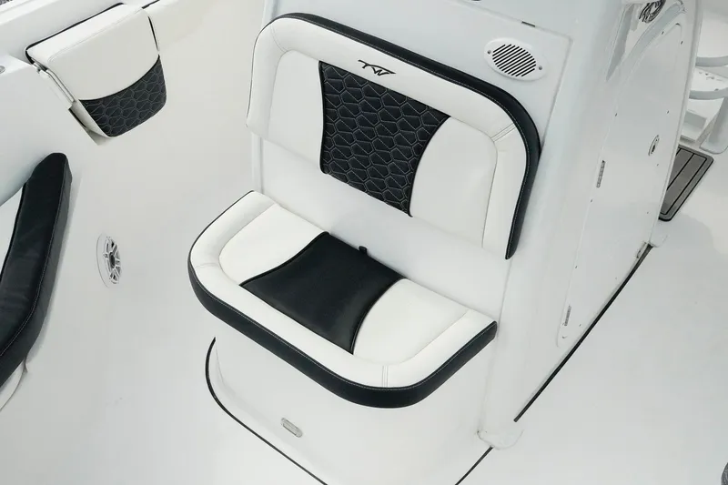 Slide: The Image of 2026 Tidewater 232 LXF boat seat with black and white upholstery, featuring a modern design. - 13