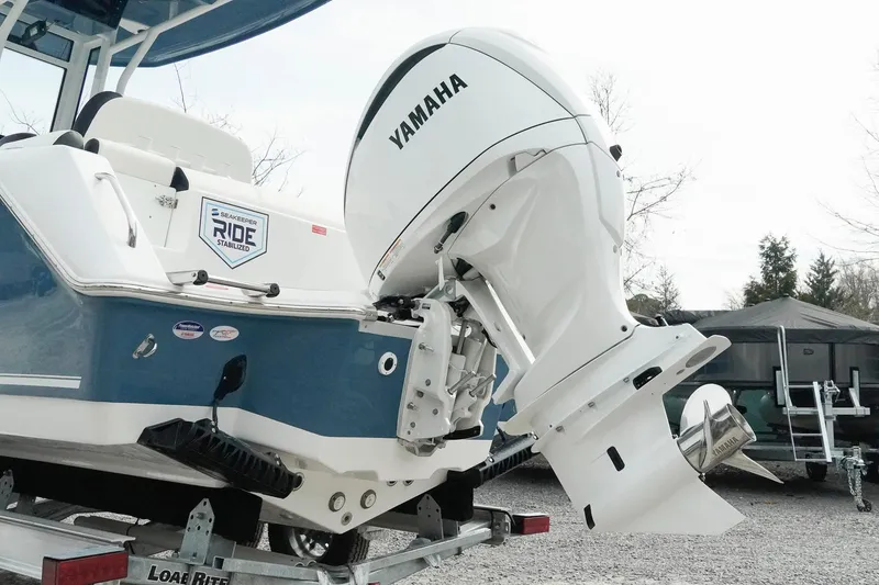 Slide: The Image of 2026 Tidewater 232 LXF boat with Yamaha outboard engine on trailer. - 16