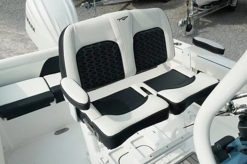Slide: The Image of 2026 Tidewater 232 LXF boat seating with black and white cushioned design. - 17