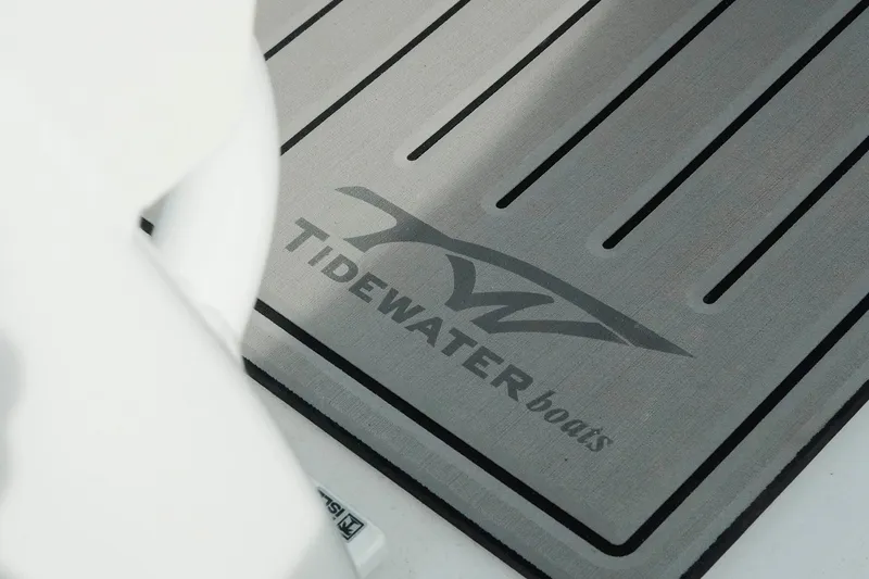 Slide: The Image of Tidewater 232 LXF 2026 boat floor mat with logo design. - 19