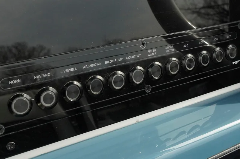 Slide: The Image of Control panel of 2026 Tidewater 232 LXF boat with labeled buttons. - 28