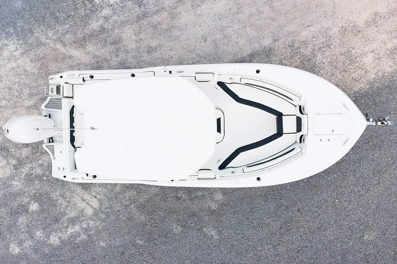 Slide: The Image of Top view of 2026 Tidewater 232 LXF boat on concrete surface. - 3