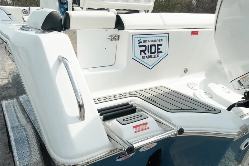 Slide: The Image of 2026 Tidewater 232 LXF boat with Seakeeper Ride stabilization system, rear seating view. - 36