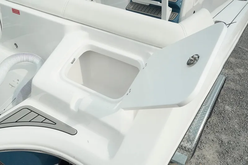 Slide: The Image of 2026 Tidewater 232 LXF boat with open storage compartment on deck. - 39