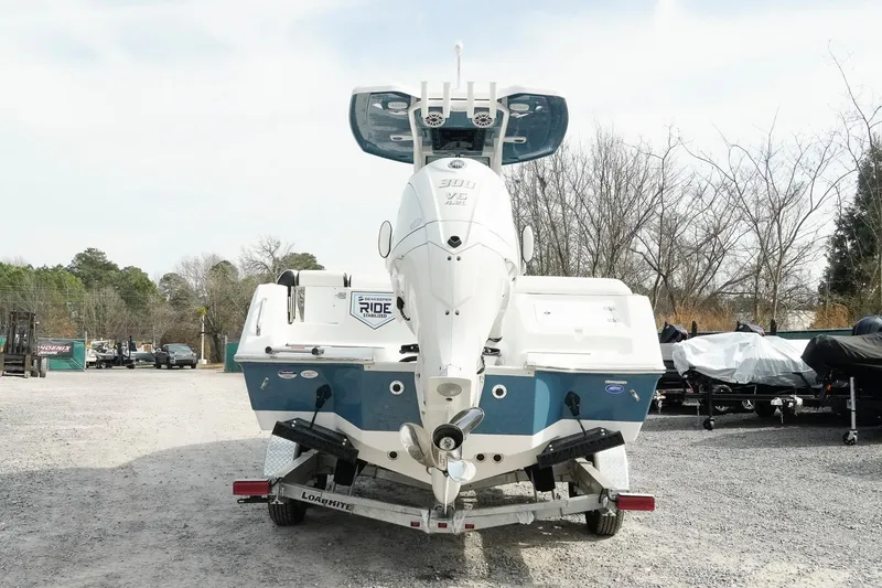 Slide: The Image of 2026 Tidewater 232 LXF boat on trailer, rear view, outdoors. - 4