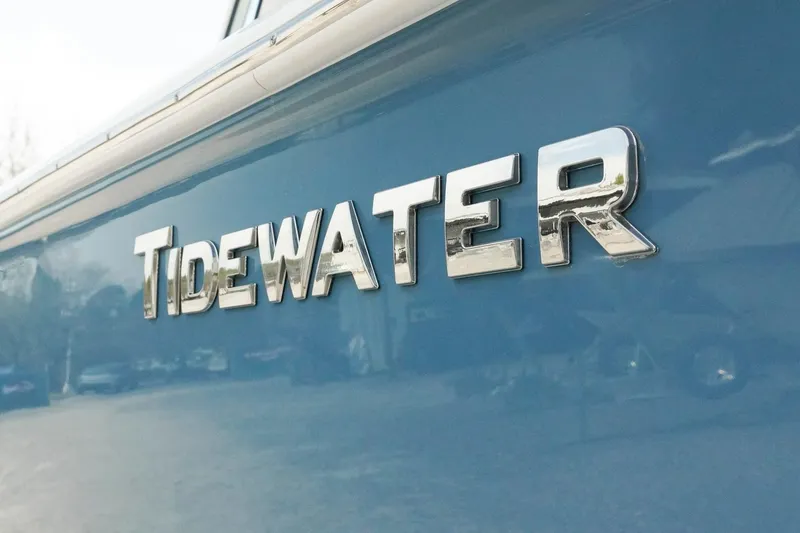 Slide: The Image of 2026 Tidewater 232 LXF boat logo on blue hull. - 40