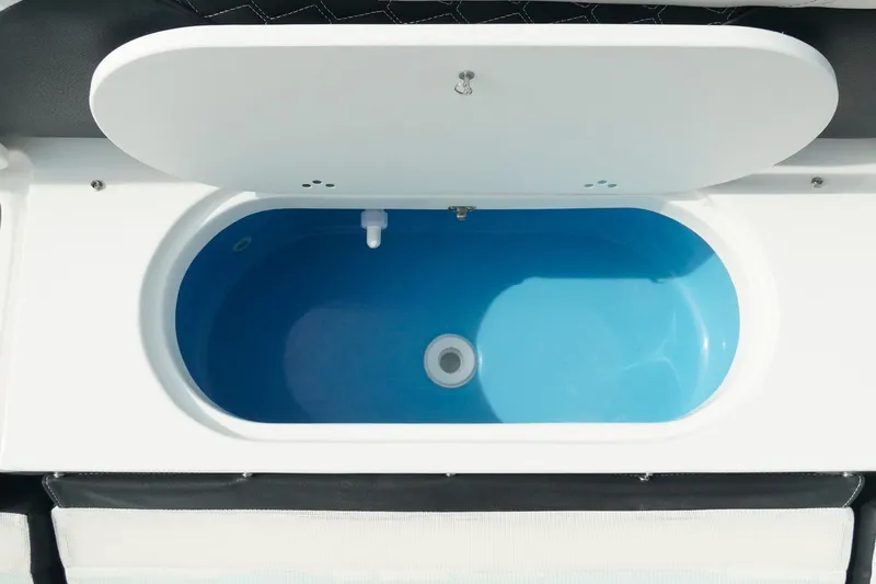 Slide: The Image of Livewell compartment on 2026 Tidewater 232 LXF boat, featuring a sleek white and blue design. - 43